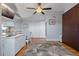 Bedroom with a white dresser, desk, and ceiling fan at 380 Pinellas Bayway S. # E, Tierra Verde, FL 33715