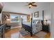 Beautifully decorated bedroom with water views, stylish furnishings, and a wood accent wall at 380 Pinellas Bayway S. # E, Tierra Verde, FL 33715