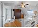 Cozy bedroom with wood floors, skylight, and attached bathroom at 380 Pinellas Bayway S. # E, Tierra Verde, FL 33715