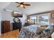 Bright bedroom with a view, wood floors, ample closet space, and a tropical ceiling fan at 380 Pinellas Bayway S. # E, Tierra Verde, FL 33715