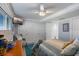 Comfortable bedroom featuring a large closet, neutral walls, and a cozy chair next to the window at 380 Pinellas Bayway S. # E, Tierra Verde, FL 33715
