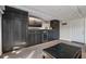 Living room featuring custom cabinets with a wine cooler, television, and tile floor at 380 Pinellas Bayway S. # E, Tierra Verde, FL 33715