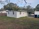 Side view of house with grassy backyard at 4106 W Mango Ave, Tampa, FL 33616