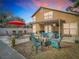 Evening view of backyard patio with seating area and covered patio at 4209 E 98Th Ave, Tampa, FL 33617