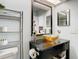 Stylish bathroom with vessel sink, granite countertop and large mirror at 4209 E 98Th Ave, Tampa, FL 33617