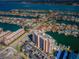 An aerial view of a condo building in a waterfront community offering dock access and gorgeous views at 51 Island Way # 1004, Clearwater Beach, FL 33767