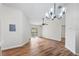 Bright dining area with wood-look floors and chandelier at 6003 Laketree Ln # L, Temple Terrace, FL 33617