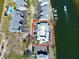 Aerial view of waterfront condo complex with ample parking and boat docks at 611 Destiny Dr # 410, Ruskin, FL 33570