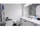 Modern bathroom with a white vanity, marble accents, and a toilet at 611 Destiny Dr # 410, Ruskin, FL 33570