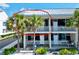 Charming condo building with balconies and lush tropical landscaping at 611 Destiny Dr # 410, Ruskin, FL 33570
