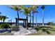 A gazebo at the end of the beach area with a wooden walkway for residents to relax and watch the sunset at 611 Destiny Dr # 410, Ruskin, FL 33570
