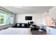 Cozy room featuring a bed, futon, table, and a convenient kitchenette in the corner at 611 Destiny Dr # 410, Ruskin, FL 33570
