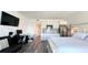 Open-concept living space features a bed, kitchenette, dining area, and entertainment area at 611 Destiny Dr # 410, Ruskin, FL 33570