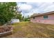 Backyard with shed and overgrown grass at 651 Southwest N Blvd, St Petersburg, FL 33703