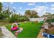 Backyard with artificial turf and playset at 651 Southwest N Blvd, St Petersburg, FL 33703