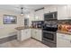 Eat-in kitchen with granite countertops and ample cabinet space at 651 Southwest N Blvd, St Petersburg, FL 33703
