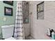 Shower with gray herringbone tile and niche at 651 Southwest N Blvd, St Petersburg, FL 33703