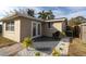 Private backyard patio with gravel landscaping and room for seating at 7014 Ivanhoe Dr, Port Richey, FL 34668
