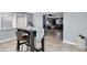 Casual dining area with view into the living room at 7014 Ivanhoe Dr, Port Richey, FL 34668
