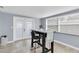 Breakfast nook with a small table and two chairs near French doors at 7014 Ivanhoe Dr, Port Richey, FL 34668