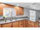Modern kitchen featuring granite countertops and ample cabinetry at 7014 Ivanhoe Dr, Port Richey, FL 34668
