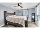 Main bedroom with ceiling fan and a large bed at 7014 Ivanhoe Dr, Port Richey, FL 34668