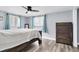 Spacious bedroom with wood flooring and a large dresser at 7014 Ivanhoe Dr, Port Richey, FL 34668
