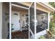 Inviting screened porch with seating and small table, perfect for relaxing at 7014 Ivanhoe Dr, Port Richey, FL 34668