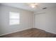 Bedroom with wood-look floors and closet at 7124 Waterside Dr # 7124, Tampa, FL 33617