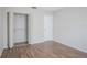 Bedroom with wood-look floors and closet at 7124 Waterside Dr # 7124, Tampa, FL 33617