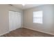 Simple bedroom with wood-look floors and closet at 7124 Waterside Dr # 7124, Tampa, FL 33617
