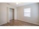 Bedroom with wood-look floors and closet at 7124 Waterside Dr # 7124, Tampa, FL 33617