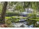 Black metal footbridge over a waterway at 7124 Waterside Dr # 7124, Tampa, FL 33617