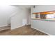 Dining area with kitchen pass-through and wood-look floors at 7124 Waterside Dr # 7124, Tampa, FL 33617