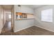 Dining area with kitchen pass-through and wood-look floors at 7124 Waterside Dr # 7124, Tampa, FL 33617