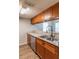 Modern kitchen with stainless steel appliances and wood cabinets at 7124 Waterside Dr # 7124, Tampa, FL 33617