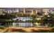 Night view of a cityscape with a waterfront and palm trees at 777 N Ashley Dr # 2503, Tampa, FL 33602