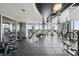 Modern gym with city views and various workout machines at 777 N Ashley Dr # 2503, Tampa, FL 33602