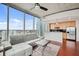 Modern living room with open kitchen and city views at 777 N Ashley Dr # 2503, Tampa, FL 33602