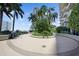 Community patio with lush landscaping, grill, and seating areas at 777 N Ashley Dr # 2503, Tampa, FL 33602