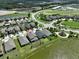 Aerial view of a house and neighborhood, showcasing the community's layout and landscaping at 9608 Ivory Dr, Ruskin, FL 33573