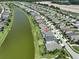 Aerial view of a house near a canal in a residential neighborhood at 9608 Ivory Dr, Ruskin, FL 33573