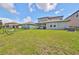Spacious backyard with a hammock and privacy fence at 9608 Ivory Dr, Ruskin, FL 33573