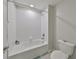 Clean bathroom featuring a shower/tub combo and toilet at 9608 Ivory Dr, Ruskin, FL 33573