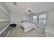 Upstairs bedroom with a queen bed and decorative wall at 9608 Ivory Dr, Ruskin, FL 33573