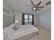 Main bedroom with ceiling fan and large windows at 9608 Ivory Dr, Ruskin, FL 33573