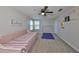 Upstairs bedroom with a daybed, exercise mat, and gymnastics bar at 9608 Ivory Dr, Ruskin, FL 33573