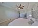 Main bedroom with ceiling fan and plush carpet at 9608 Ivory Dr, Ruskin, FL 33573