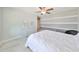 Bright bedroom with plush carpeting and ceiling fan at 9608 Ivory Dr, Ruskin, FL 33573