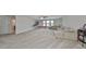 Large bonus room with a sectional sofa and a basketball game at 9608 Ivory Dr, Ruskin, FL 33573